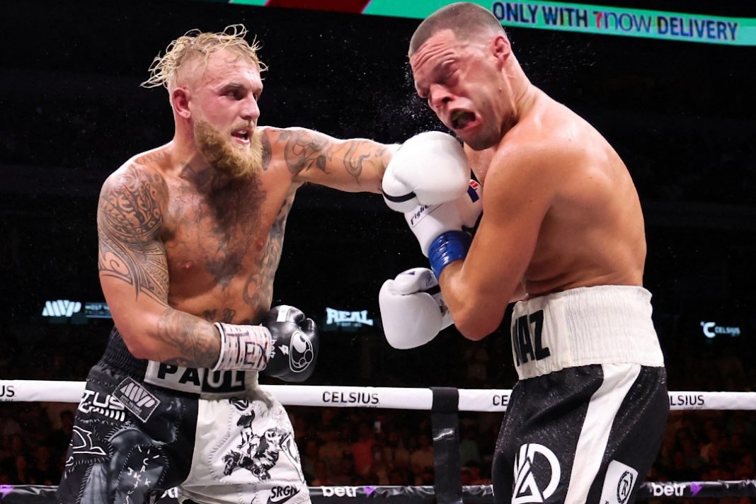 Jake Paul punching Nate Diaz in the face